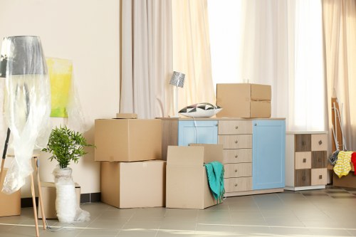 Office relocation planning in Holloway with moving boxes and desks