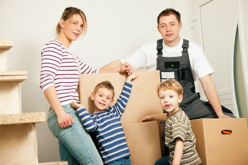 Professional movers handling boxes and furniture in Holloway