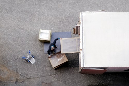 Professional movers handling furniture during a Holloway house move