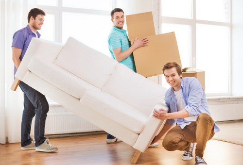 Loading furniture into a moving truck in Holloway