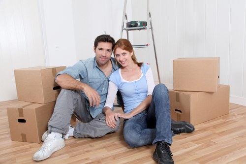Trained removals staff handling items carefully during a move