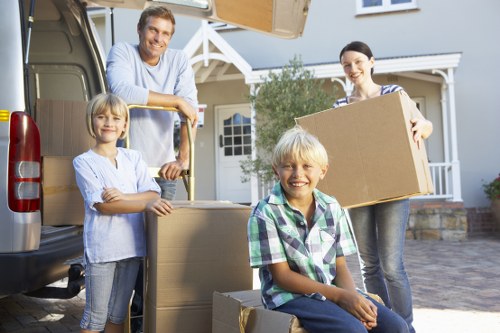 Professional removal team packing household items in Holloway