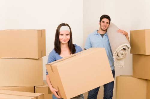 Professional movers handling furniture in Holloway