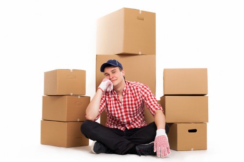 Professional removals crew loading items into a van